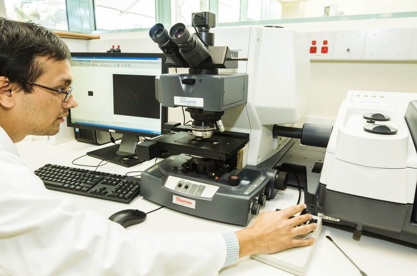 A scientific instrument, called an infrared spectrometer, in a laboratory