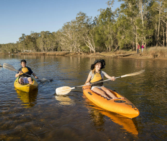 People paddling kayaks on Lake Innes Nature Reserve