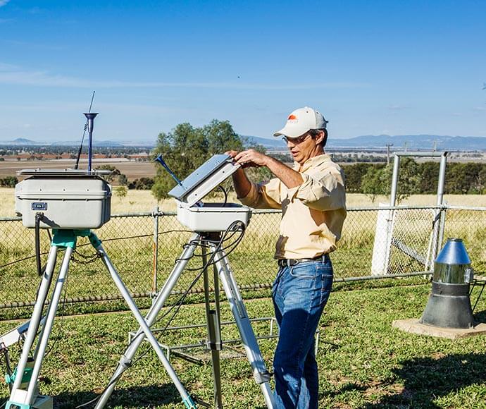 OEH scientist checking a dust watch monitoring station in Gunnedah