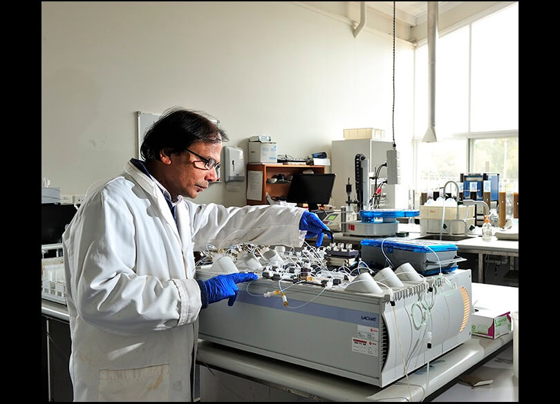 A Flow Injection Analysis instrument being used by a technician used to test for Nutrients in soil and sea water at the Soil Health and Archive laboratory located at Yanco NSW.