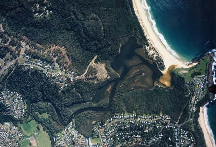 A view of Back Lagoon, surrounded by Short Point Beach and the seaside town of Merimbula