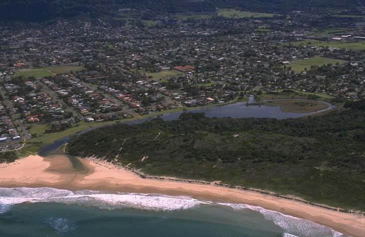 A view of Bellambi Lake surrounded by North Wollongong with Corrimal Beach in the foreground