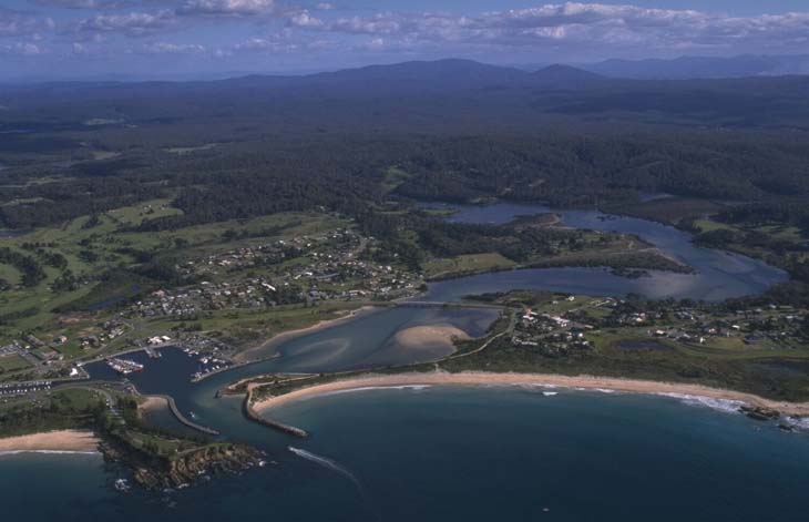 A view of Bermagui River flowing past the town of Bermagui and into the sea at Bermagui Point