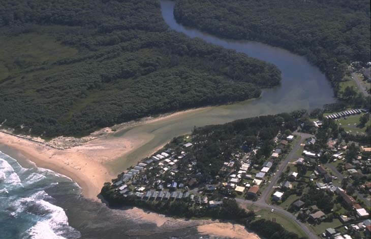 A view of the Berrara Creek's closed entrance next to the town of Berrara