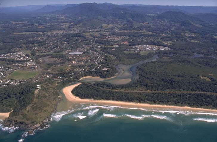  A view of Boambee Creek meeting the sea surrounded by Coffs Harbour and Sawtell Beach in the foreground