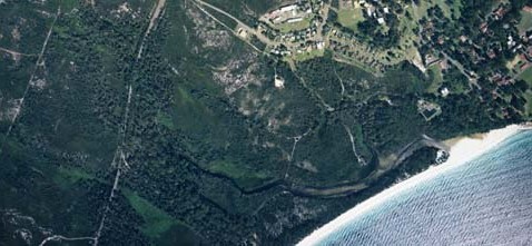 A view of Captains Beach Lagoon meeting the sea at Jervis Bay