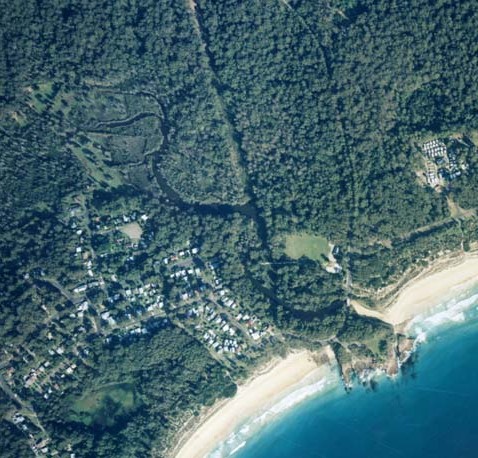 A view of Durras Creek meeting the sea near the village of South Durras