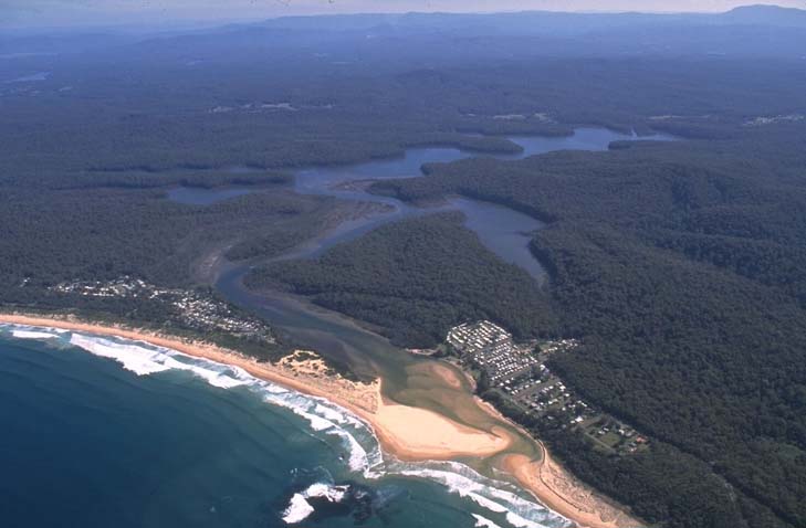 A view of Durras Lake meeting the sea surrounded by the village of South Durras, South Durras Beach and North Durras Beach