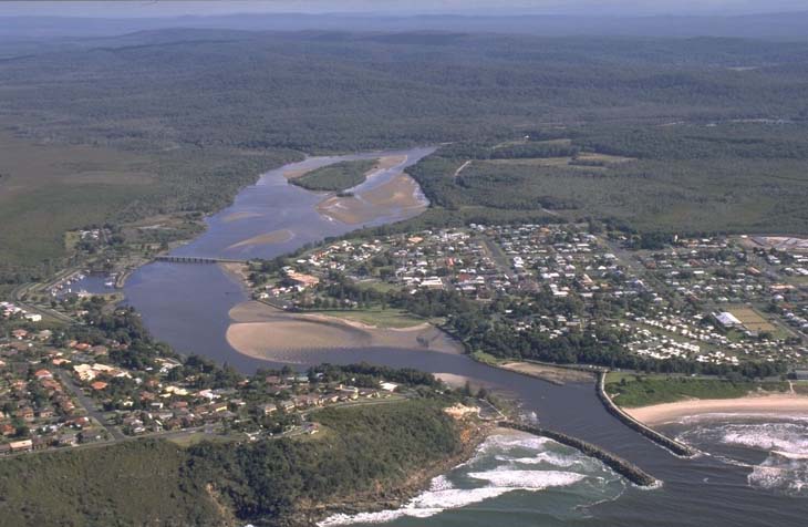 A view of Evans River meeting the sea surrounded by the town of Evans Head and Airforce Beach in the foreground