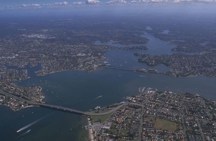 A view of Georges River flowing into Botany Bay surrounded by Sydney's southern suburbs