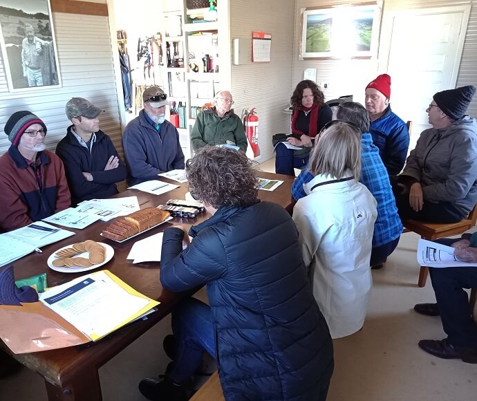 Group of people around a table having a meeting