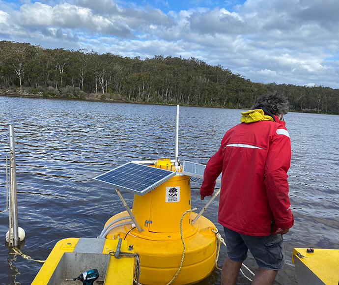 Deploying a water quality monitoring buoy in Wonboyn Lake. 