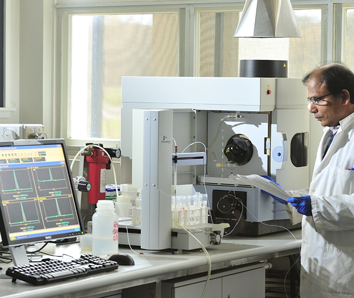 A technician works on an Inductively Coupled Plasma Atomic Emission Spectrometer (ICPAES) instrument used to test for Elemental Analysis at the Soil Health and Archive laboratory located at Yanco NSW.