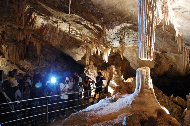 Group of people looking at Broken Column, Lucas Cave, Jenolan Caves