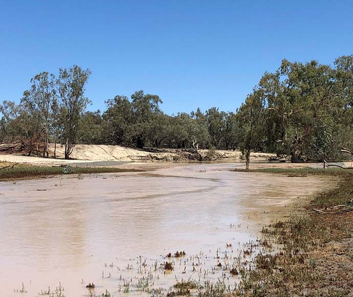 Looking south at water flowing down the Warrego River where Peebles Dam used to be (after the completion of phase 1 works)