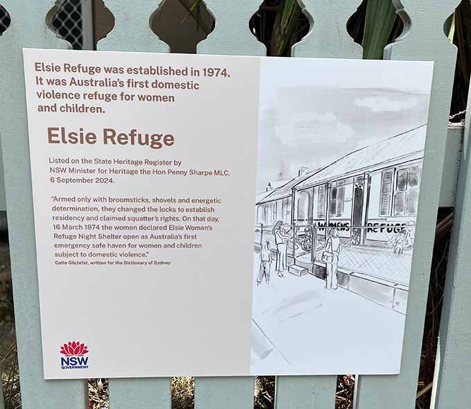 Sign on fence describing history of Elsie Refuge, established in 1974.