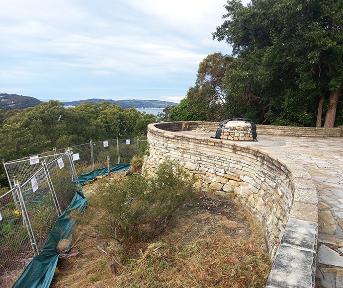 A view of the site fencing at West Head Lookout, designed to enhance safety and protect the natural environment, with surrounding native vegetation visible in the background.