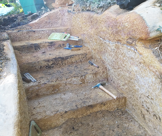 New stonework is installed as part of the track