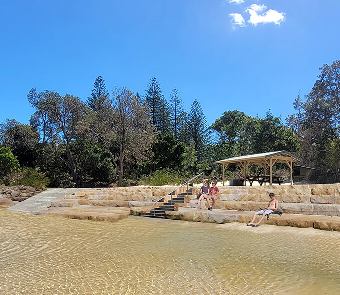 Large sandstone steps, bleachers, ramp and beach access ramp, Arakoon National Park concept photo.