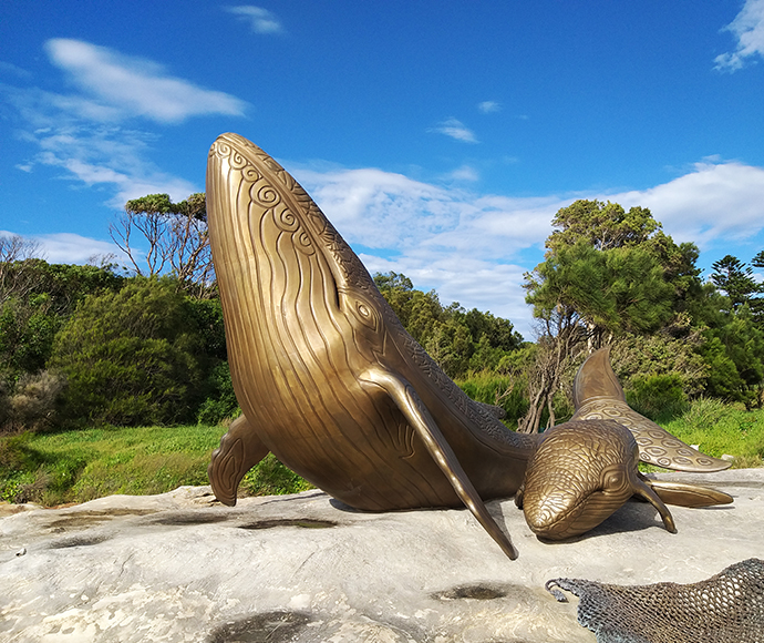 Kurnell Whale Sculptures - Second View: Another angle of the whale bone sculptures at Kurnell, highlighting their size and alignment with the coastal landscape, commemorating Indigenous heritage and marine life.