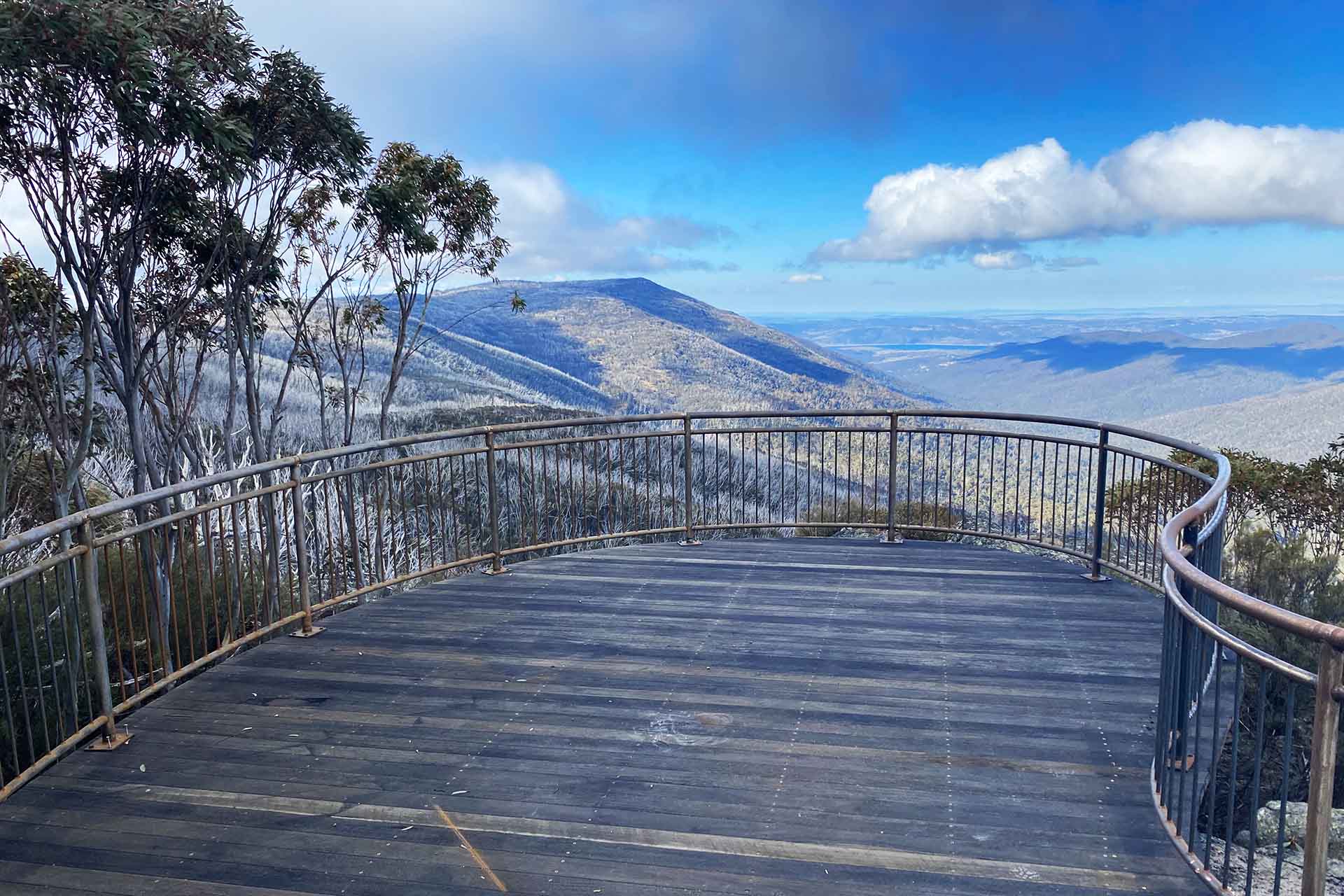 Wooden and fenced platform looking out to valley