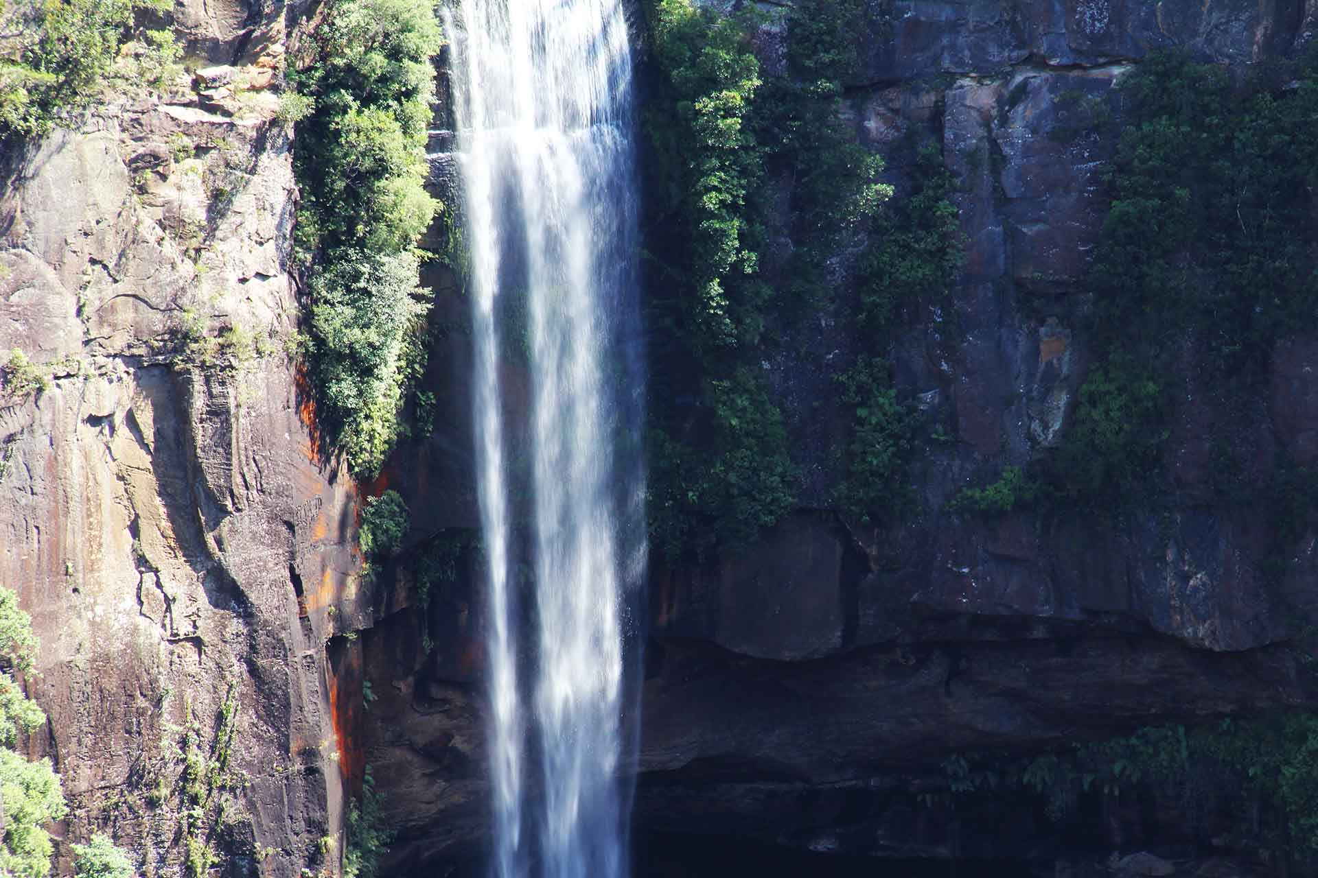 Waterfall with rocky backdrop