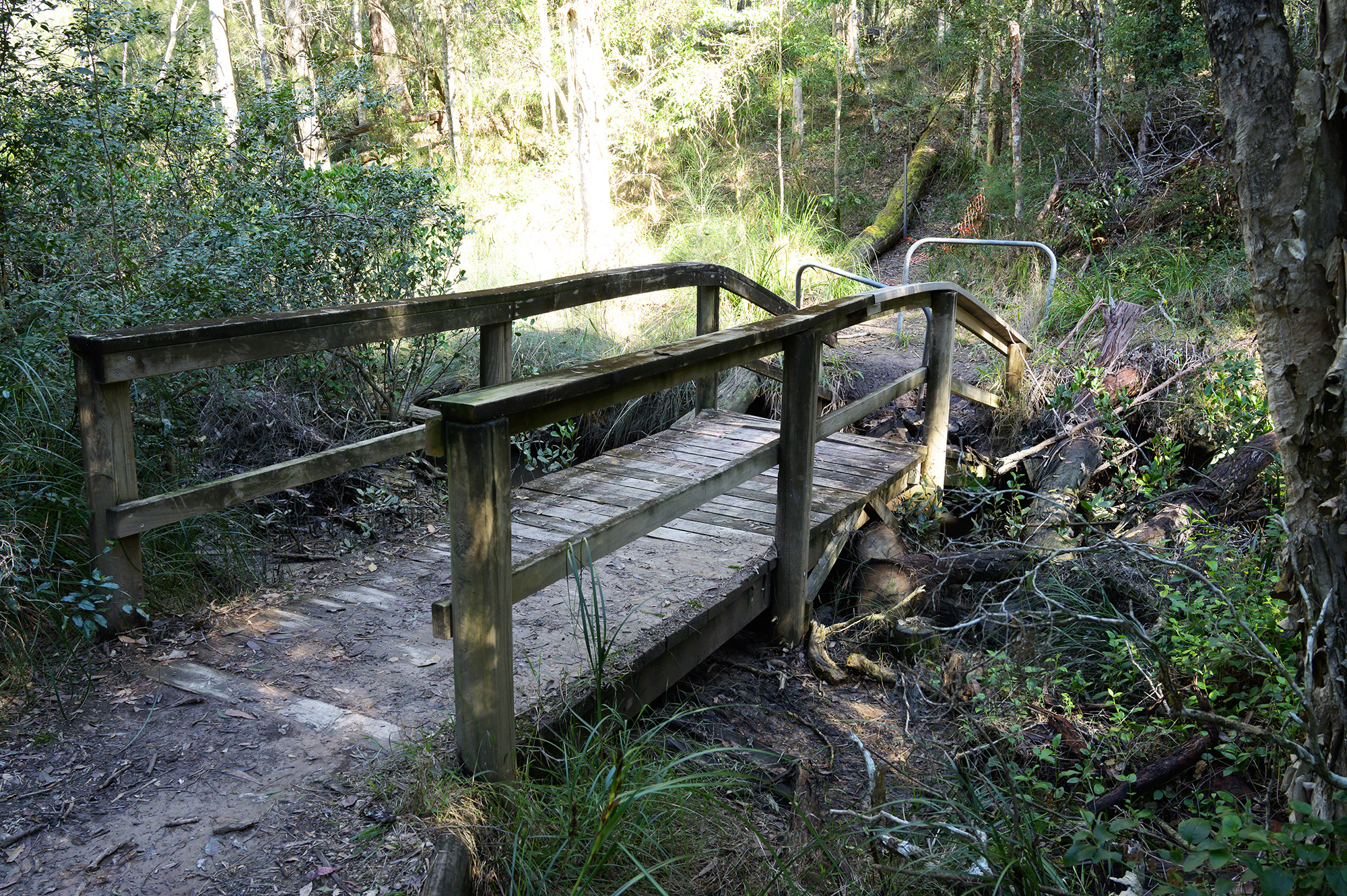 A broken wooden footbridge