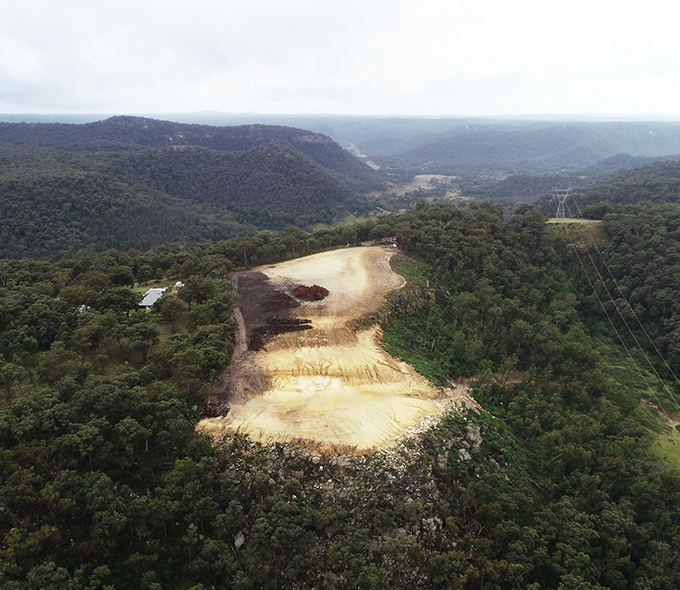 Bald hill surrounded by trees