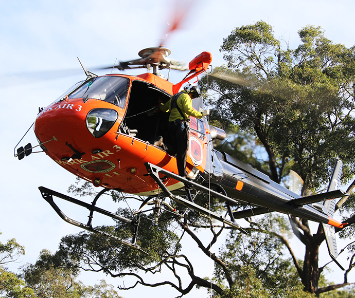 Crewman on NPWS helicopter skid