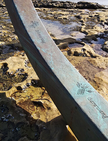 The Eyes of the Land and the Sea - Close-up: A detailed view of one of "The Eyes of the Land and the Sea" sculptures, depicting stylized, interconnected eye shapes. This artwork represents the connection between land and sea in Aboriginal culture.